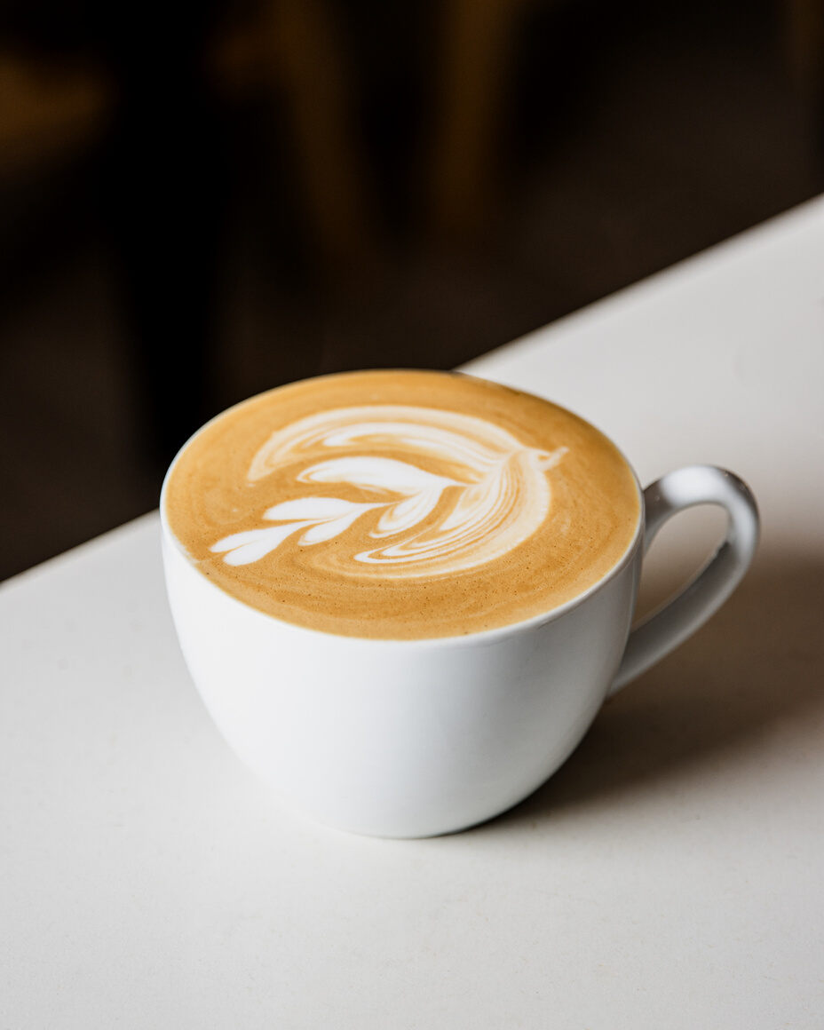 Coffee Latte on White Ceramic Cup